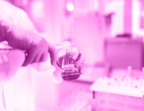 scientist-working-in-laboratory-pouring-liquid-PD2F62K-03